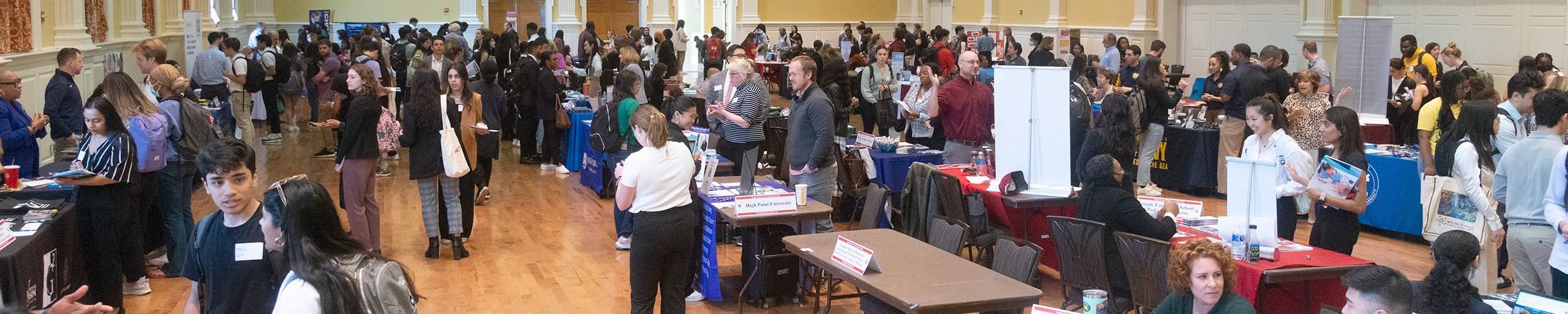 A large crowd of people, including students and representatives of many universities' medical schools, at the HPAO-hosted Health Professions Career Fair