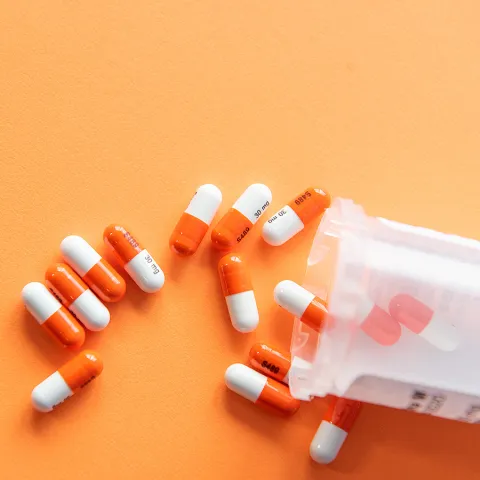 pills falling from a pill bottle