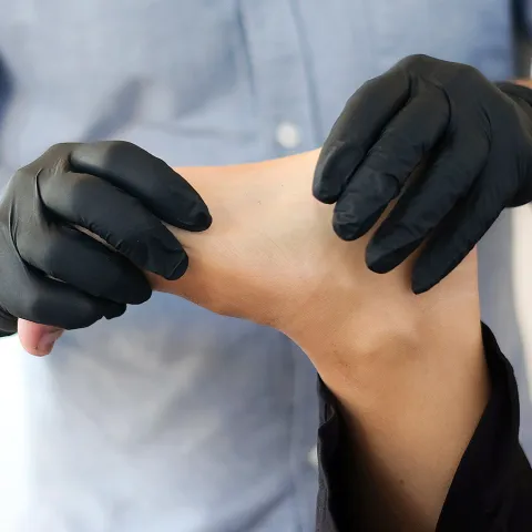 podiatrist looking at a foot